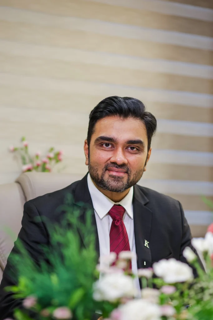 Dr. Kulin Sheth, senior interventional cardiologist in Ahmedabad, consulting patients at his cardiac clinic in Bopal